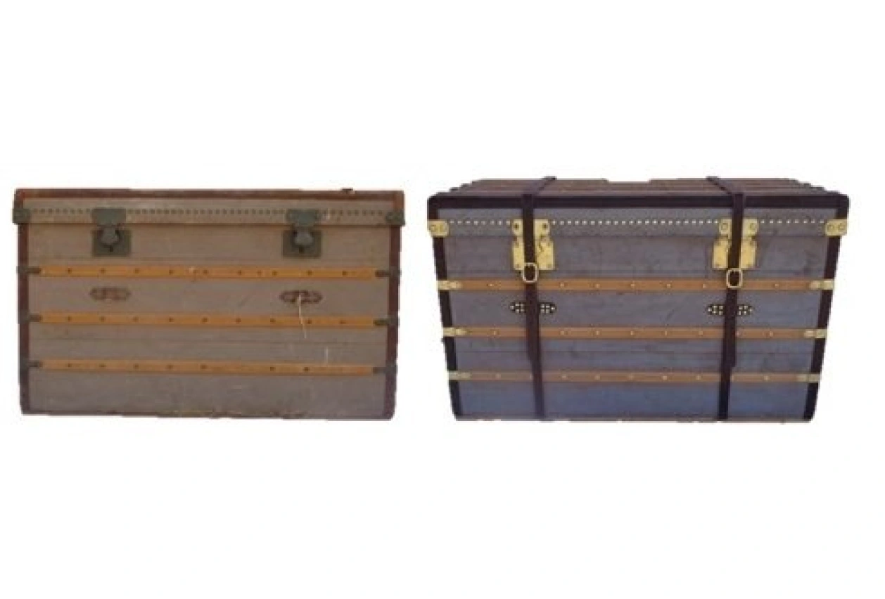 Two vintage trunks with metal accents.
