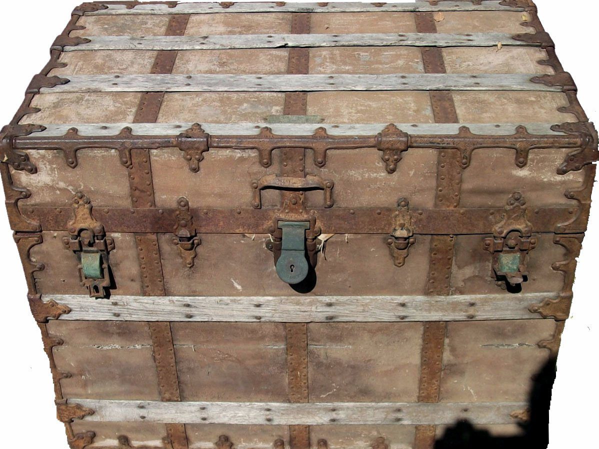 Antique wooden steamer trunk with metal bands