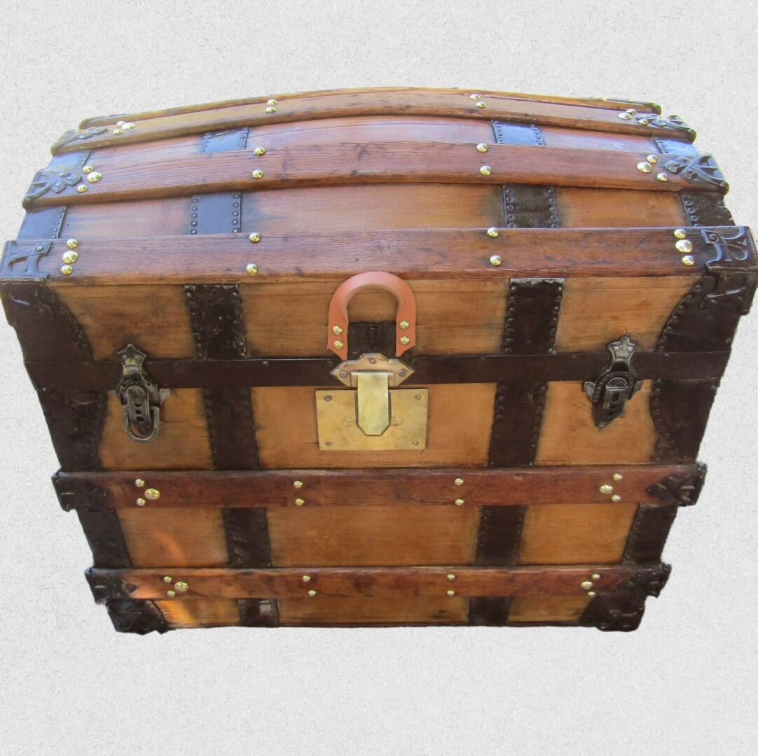 Vintage wooden steamer trunk with brass hardware