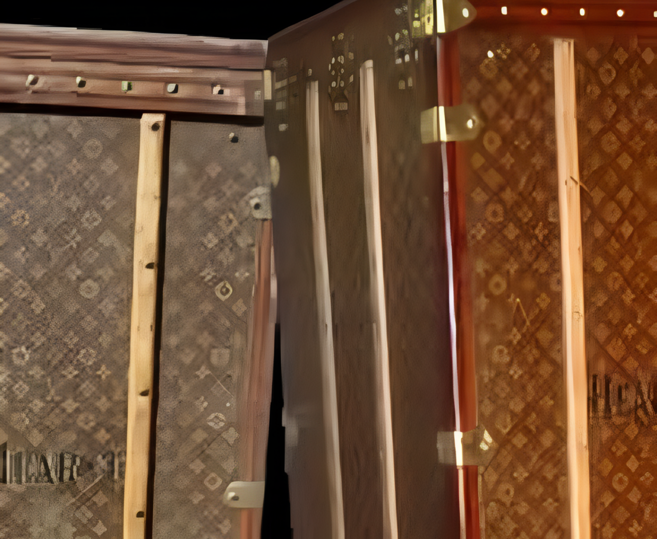 Close-up of monogrammed vintage luggage trunks